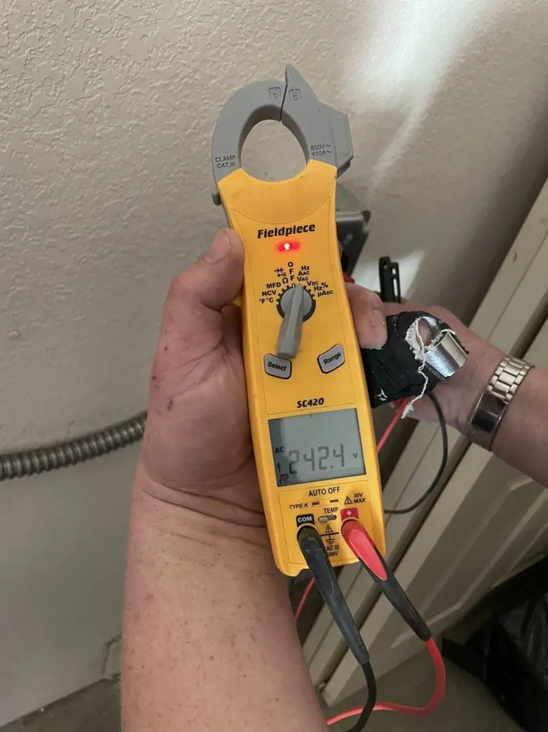 Voltage testing with clamp meter during Electrical Installation Services in Caldwell